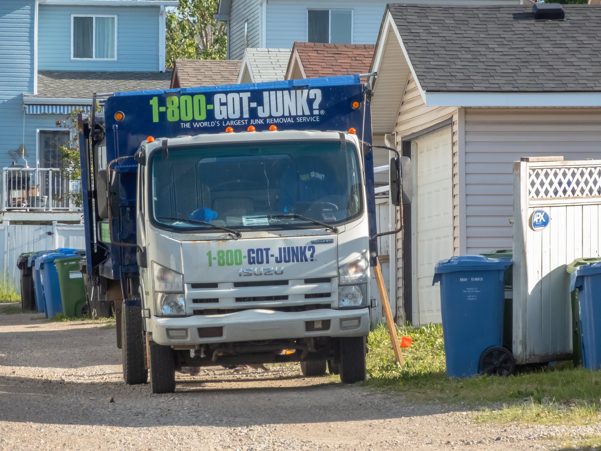 Junk removal truck in residential area